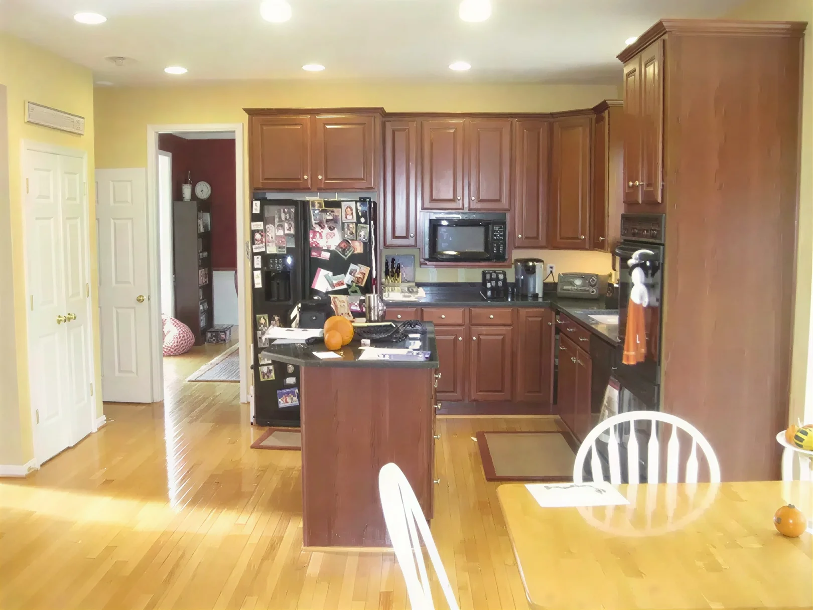 Double Island Kitchen Design image by Solstice Kitchen & Bath Double Island Kitchen Design dark wood kitchen with island and dining area.jpg