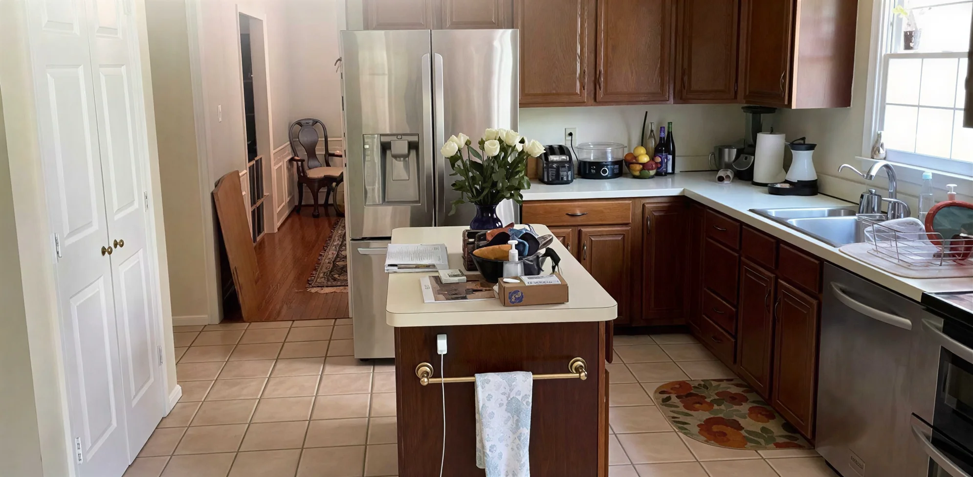 A Timeless Home Design traditional kitchen dark wood cabinets island